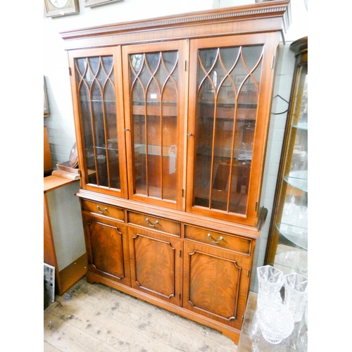 168 - A Georgian style lattice glazed mahogany three door bookcase with drawers and cupboards under, 4'6 w... 