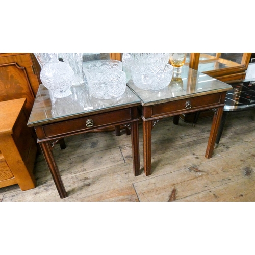 171 - A pair of mahogany lamp tables, each fitted one drawer with glass tops