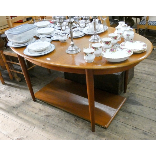 99 - A 1970's Danish teak oval extending dining table with two extra leaves