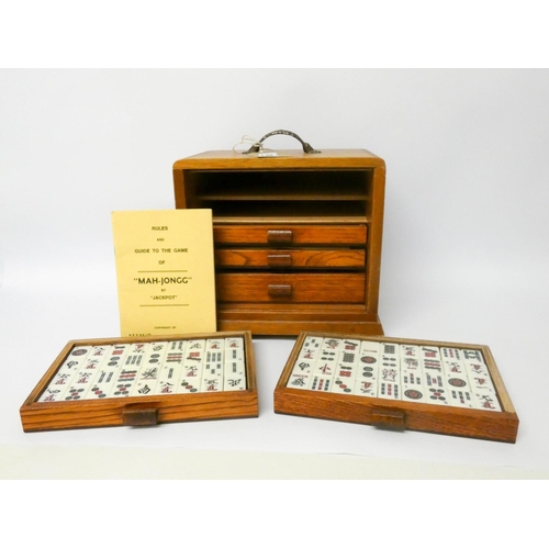 502 - A Mahjong set in small wooden cabinet with interior drawers