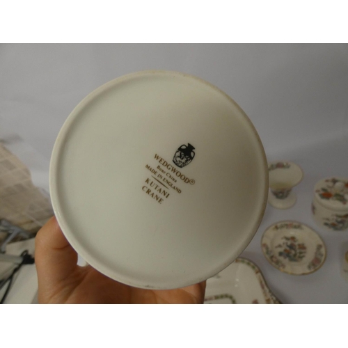 509 - A collection of Wedgwood Kutani Crane patterned bone china