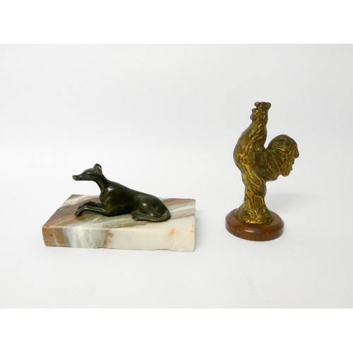 511 - A small bronze whippet on marble base and a gilded bronze cockerel