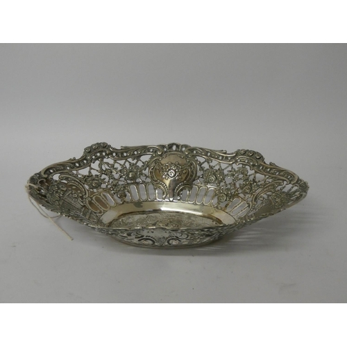 618 - An oval continental 900 standard silver pierced sweetmeat dish decorated with cherubs, 8 1/4