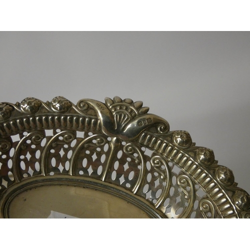 619 - A silver pierced sweetmeat basket and a French hallmarked silver oval pierced dish with wood base