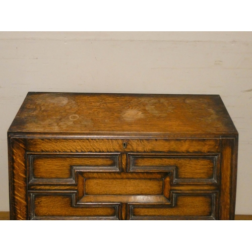 741 - A Jacobean style oak bureau with two drawers under standing on barley twist legs, 2'6 wide