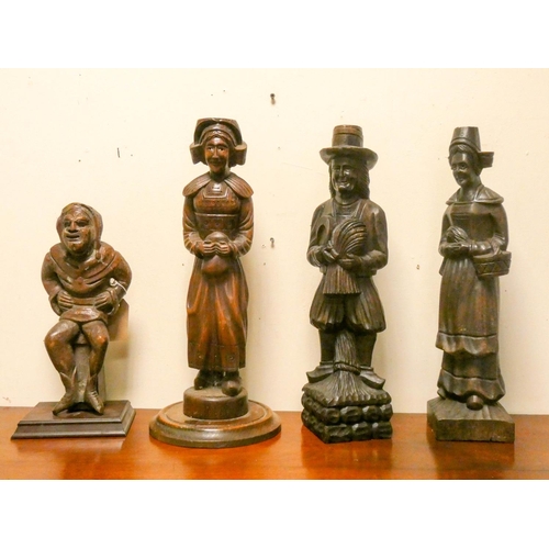 756 - Four assorted carved wooden figure ornaments, three are 8