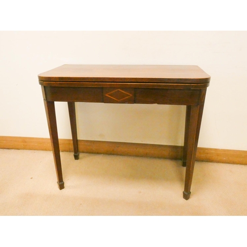 761 - A Georgian inlaid mahogany folding top tea table on square taper legs with spade feet, 3' wide