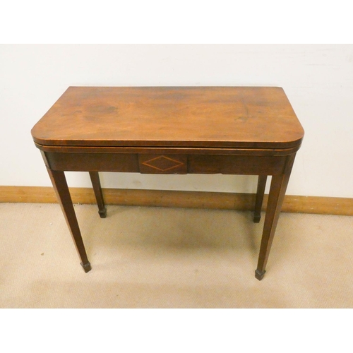 761 - A Georgian inlaid mahogany folding top tea table on square taper legs with spade feet, 3' wide