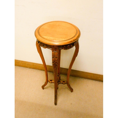 790 - A circular pale mahogany plant stand on cabriole style legs with carved frieze and legs, 35