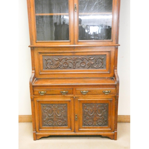 822 - An Edwardian walnut secretaire bookcase with glazed cabinet back, well fitted interior, drawers and ... 