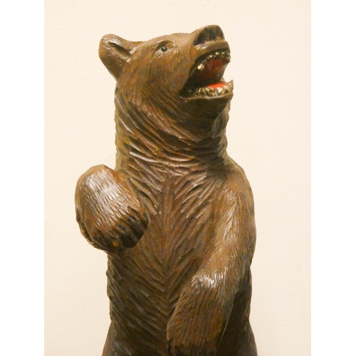 846 - A carved wooden black forest bear, 10