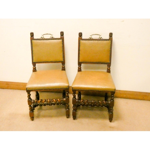 883 - A pair of carved oak and barley twist dining room chairs with leather seats and backs