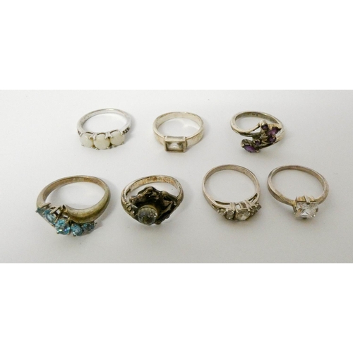 662 - A collection of ladies silver dress rings set various stones.