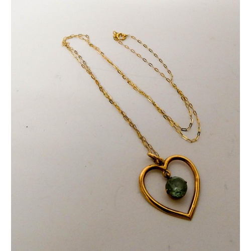 663 - A peridot set heart shaped pendant on 9ct gold chain and pair of matching heart shaped ear studs