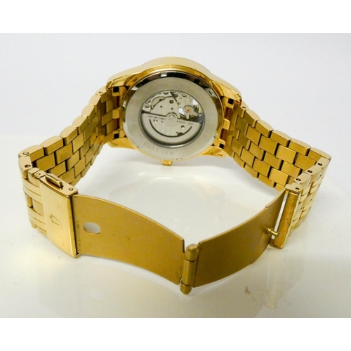 678 - Gentleman's Bulova gold plated automatic wristwatch with visible movement via glazed back.