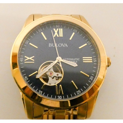 678 - Gentleman's Bulova gold plated automatic wristwatch with visible movement via glazed back.