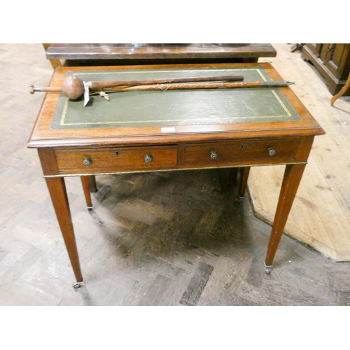 785 - An Edwardian mahogany writing table, fitted with drawers with beaded brass mounted top, standing on ... 