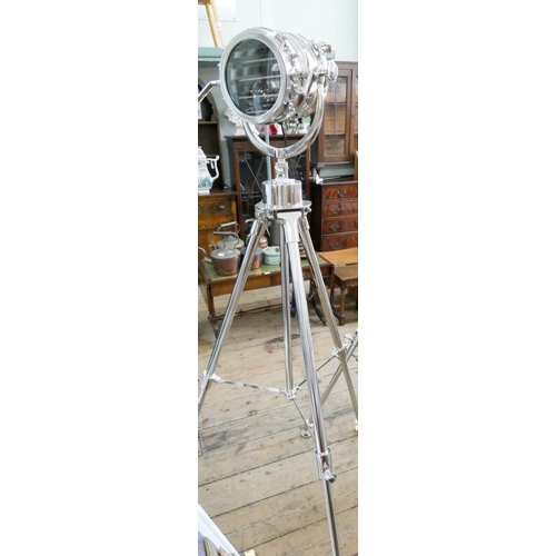 106 - An industrial search light style steel spotlight on adjustable tripod base