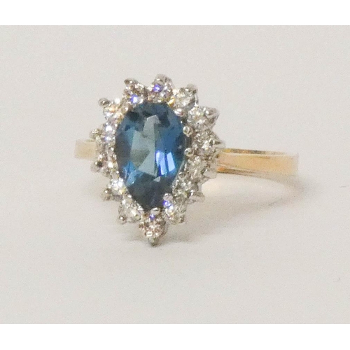 639 - A blue topaz and diamond tear drop shaped cluster ring, on 9ct gold band, ring size O