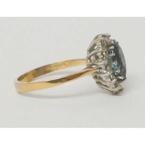 639 - A blue topaz and diamond tear drop shaped cluster ring, on 9ct gold band, ring size O