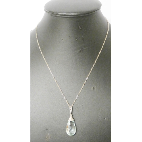 683 - An aquamarine pendant, set with a tear drop aquamarine with diamond set pave mount, on fine 14ct gol... 