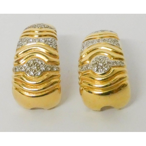 687 - Pair of 18ct yellow gold diamond earrings, of half hoop design with post and safety clip fittings. 9... 