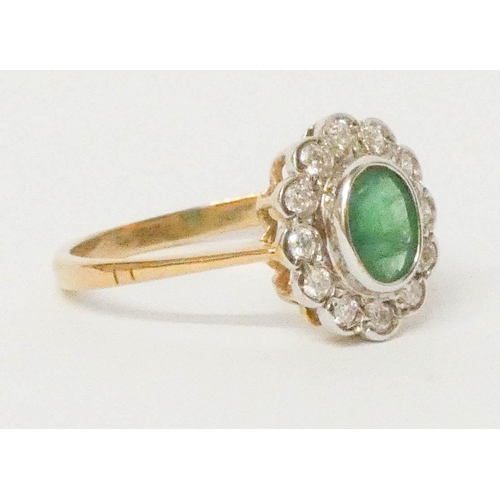 700 - An oval emerald and diamond cluster ring, on 9ct yellow gold band, ring size R