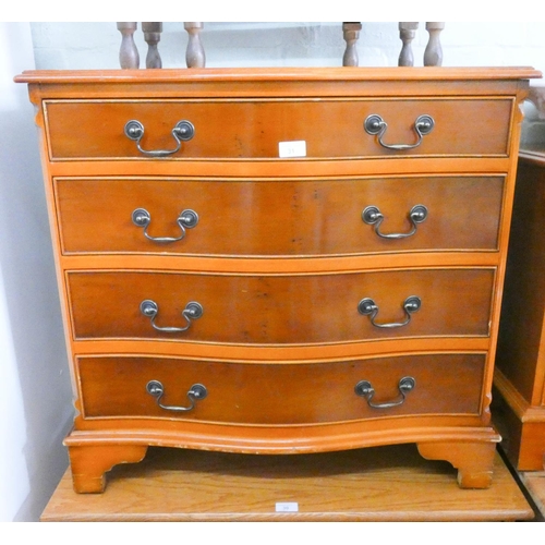 31 - Reproduction yew wood serpentine front chest of four long drawers, 2'6 wide