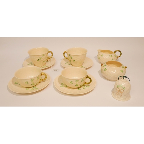 545 - Belleek shamrock decorated tea ware, comprising of four cups, four saucers, cream jug and sugar bowl... 