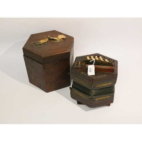 536 - A Victorian concertina with 29 stops and mahogany carrying case