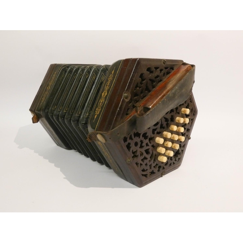 536 - A Victorian concertina with 29 stops and mahogany carrying case