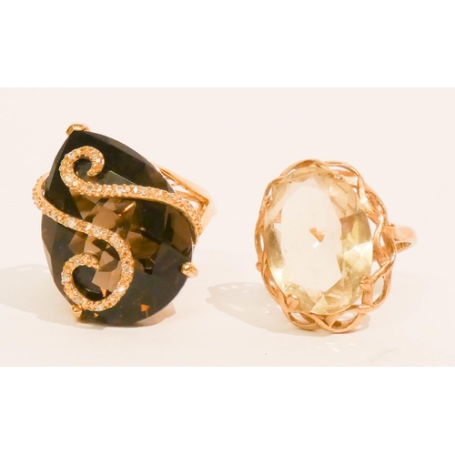 654 - 9ct gold lemon topaz ring, size P, and a modern 9ct gold smoky quartz pear shaped dress ring, size P