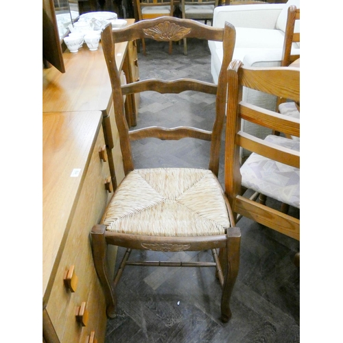 56 - A set of four French ladder back style dining room chairs with rush seats