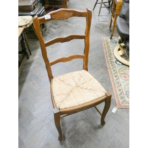 56 - A set of four French ladder back style dining room chairs with rush seats