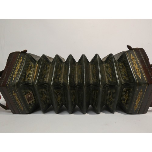 536 - A Victorian concertina with 29 stops and mahogany carrying case