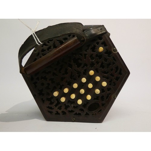 536 - A Victorian concertina with 29 stops and mahogany carrying case