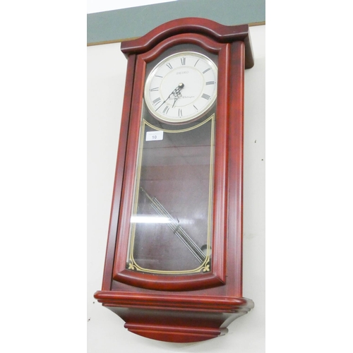 10 - A Seiko chiming wall clock in mahogany and glazed case