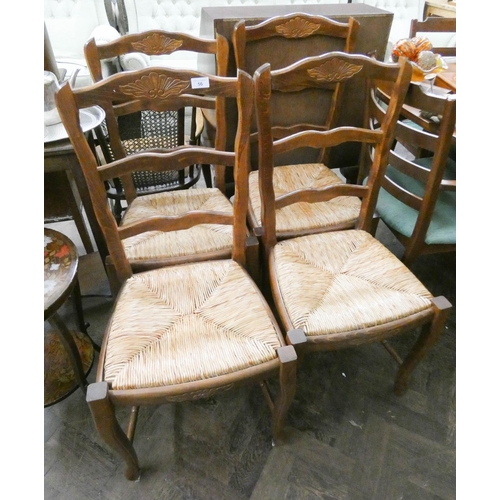 56 - A set of four French ladder back style dining room chairs with rush seats