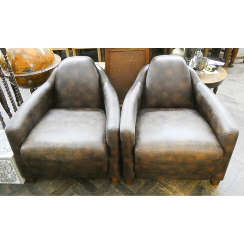 63 - A pair of tub shaped faux brown leather easy chairs