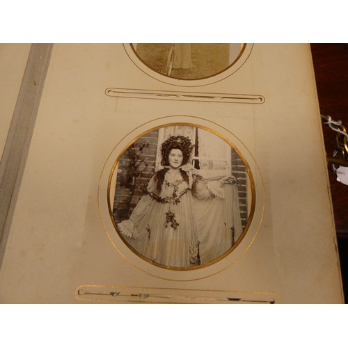 529 - An old leather bound Victorian photograph album together with a 1953 Coronation coach in its origina... 