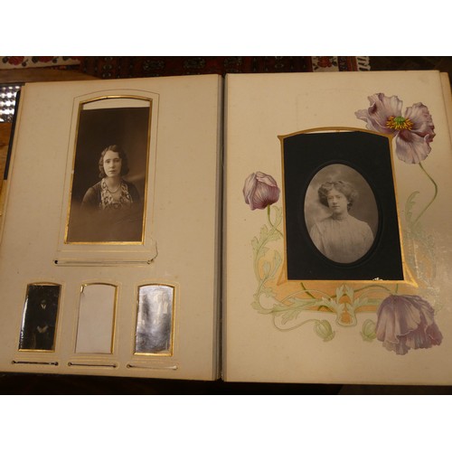 529 - An old leather bound Victorian photograph album together with a 1953 Coronation coach in its origina... 