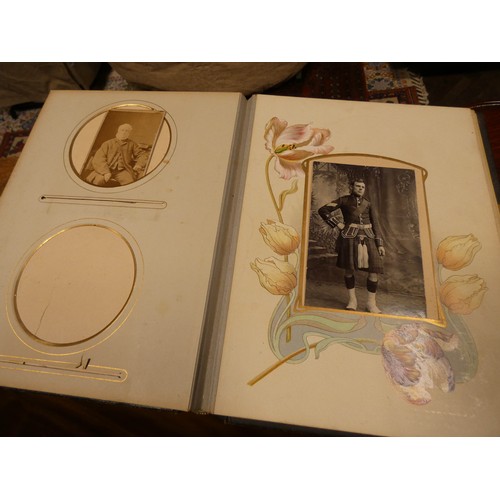 529 - An old leather bound Victorian photograph album together with a 1953 Coronation coach in its origina... 