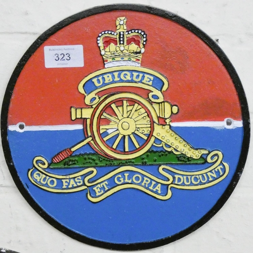 285 - A circular cast iron wall hanging Royal Artillery sign