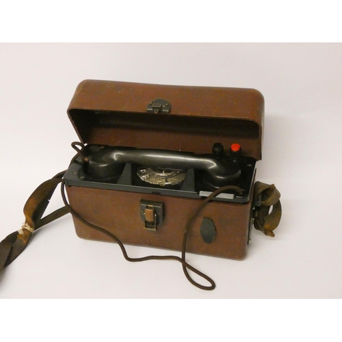 117 - A field telephone in leather case