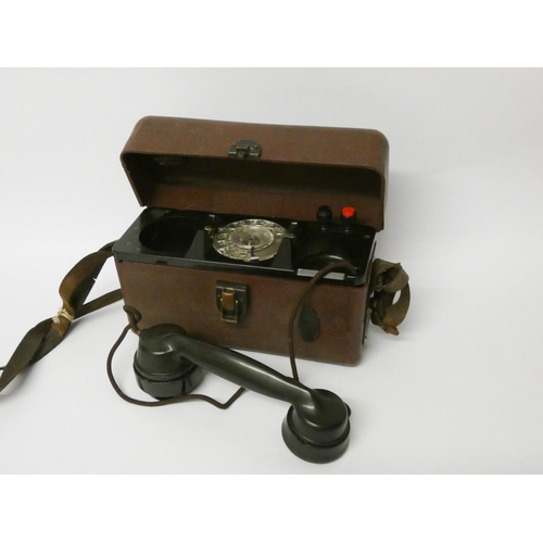 117 - A field telephone in leather case