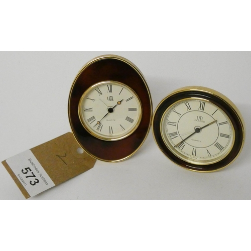 522 - A Jaccard vintage travel alarm clock in oval case and another in circular case, both working