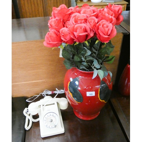 105 - A Poole Pottery vase with roses and a cream Bakelite phone