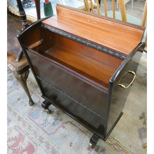 114 - A small mahogany finished lift top drinks trolley