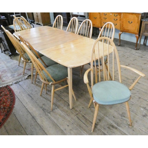 115 - An Ercol light elm extending dining table with two centre leaves, 7'6 x 3' with leaves in together w... 