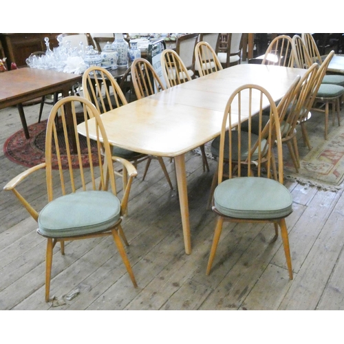 115 - An Ercol light elm extending dining table with two centre leaves, 7'6 x 3' with leaves in together w... 